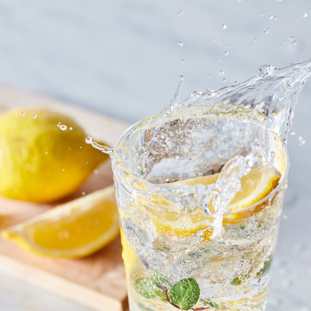 Electrolyte-rich summer foods including watermelon, cucumber, citrus fruits, avocado and yoghurt.